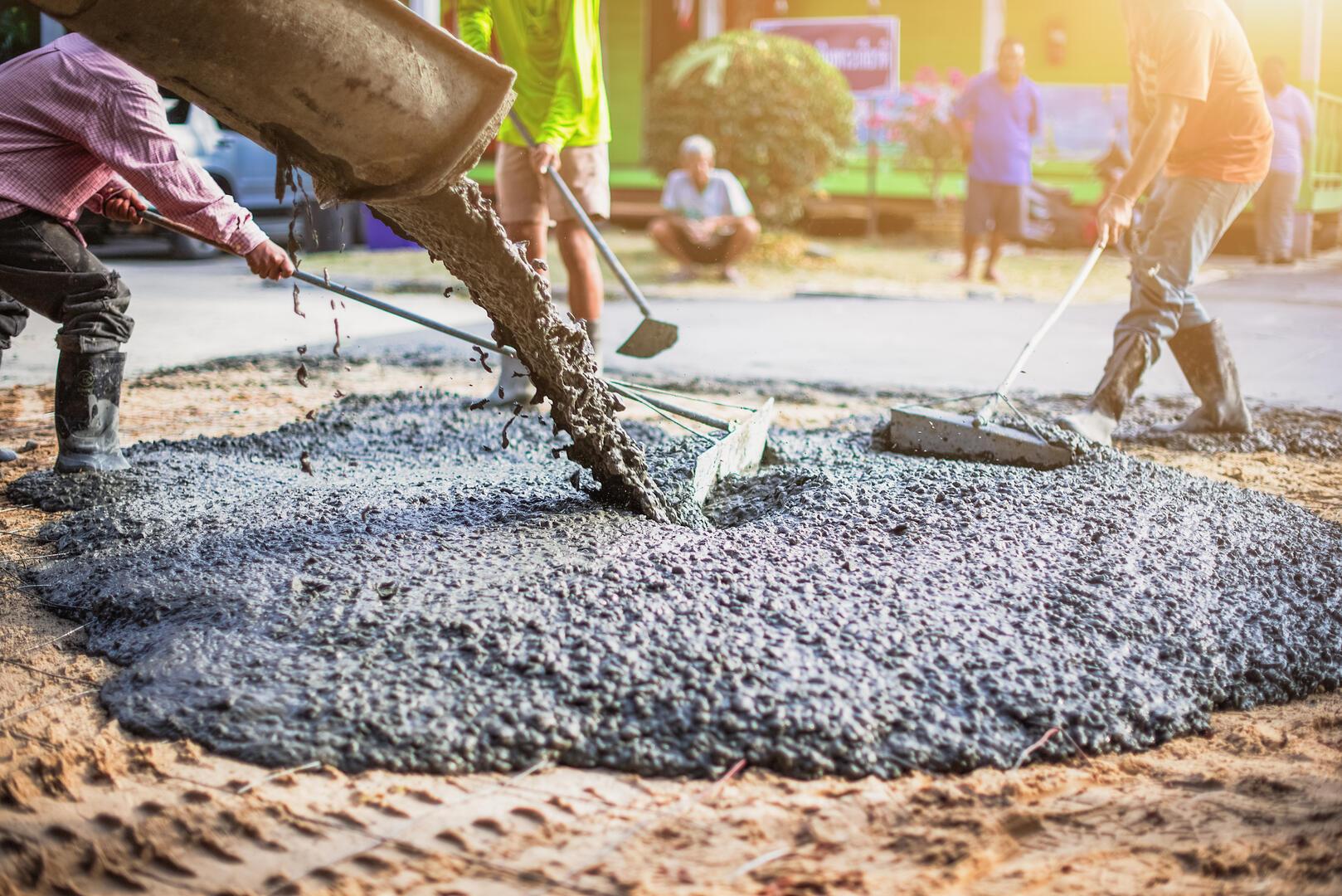 Custom concrete driveway and decorative stamped patio construction in The Woodlands, TX