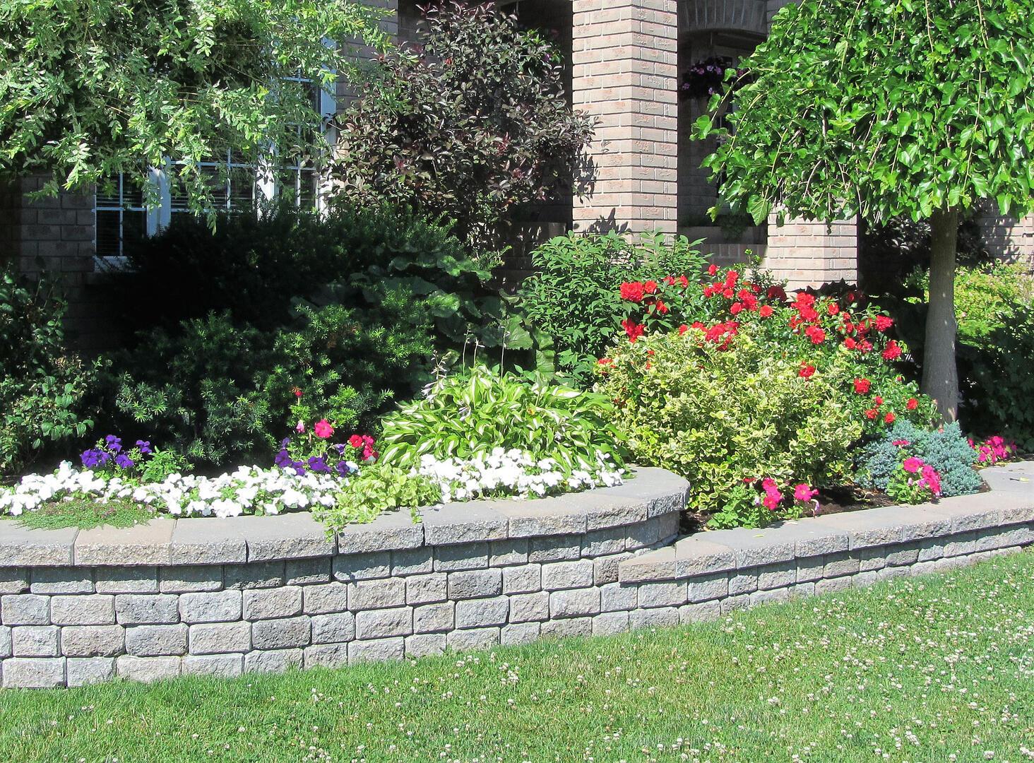 Engineered natural stone retaining wall and landscape terracing in Spring, TX